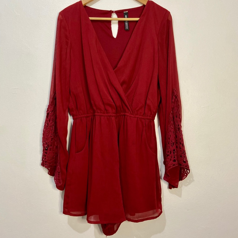 Red romper with lace detail sleeves